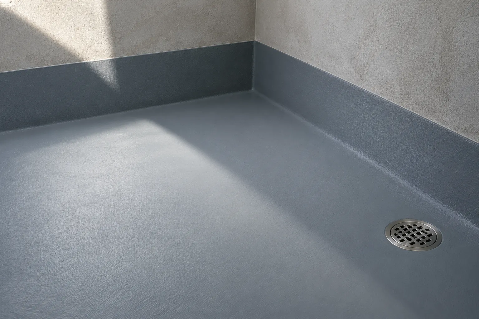 Concept detail of wet-room waterproofing around a floor drain and wall junction